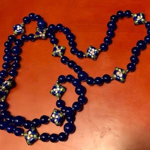 Long Beaded Necklace with Flower Detail